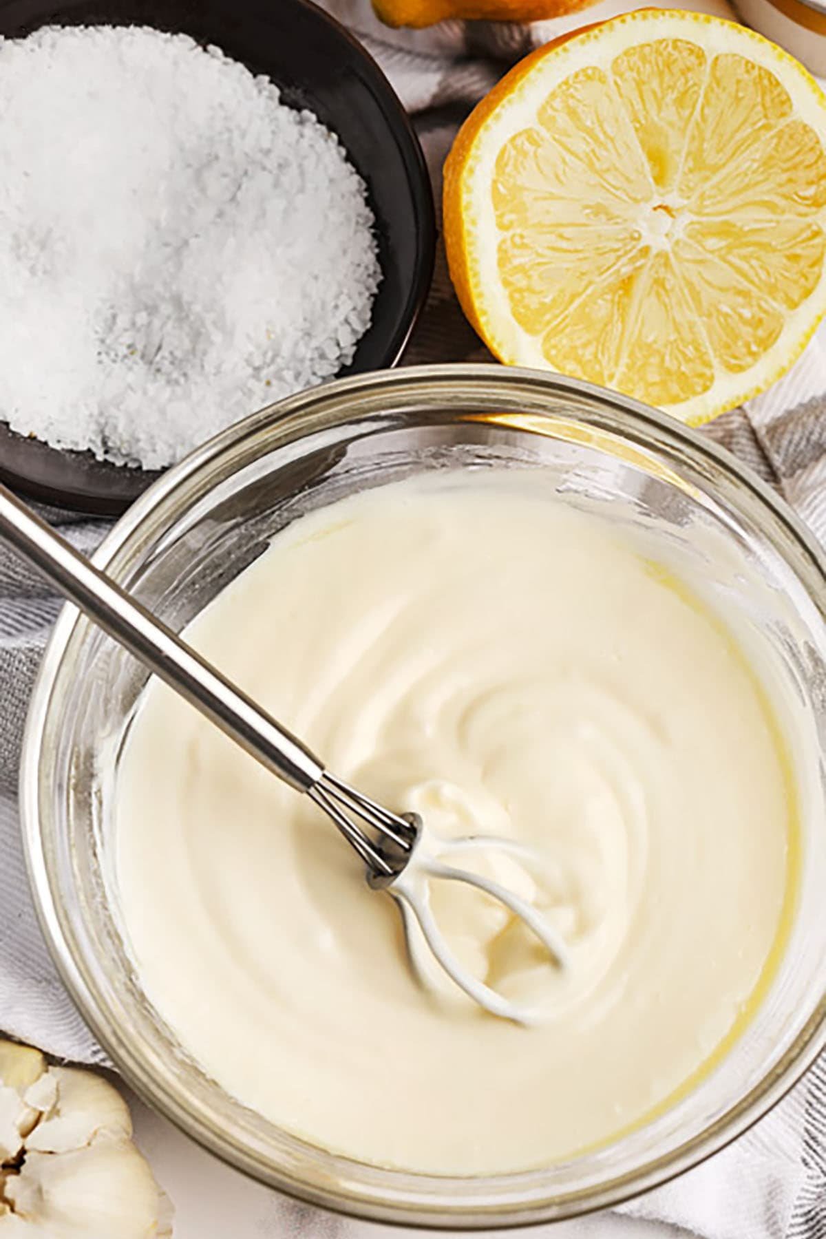 mixing ingredients together in bowl to make Aioli
