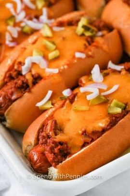 close up of Chili Cheese Dogs on a plate