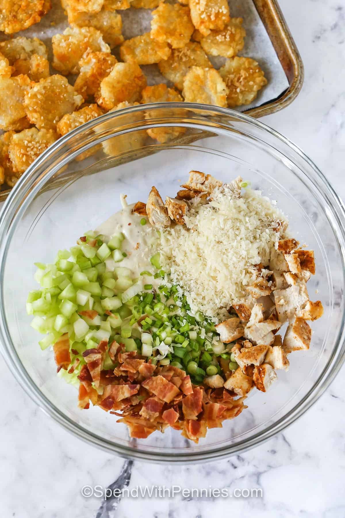 Crispy Tater Caesar Salad ingredients in a bowl