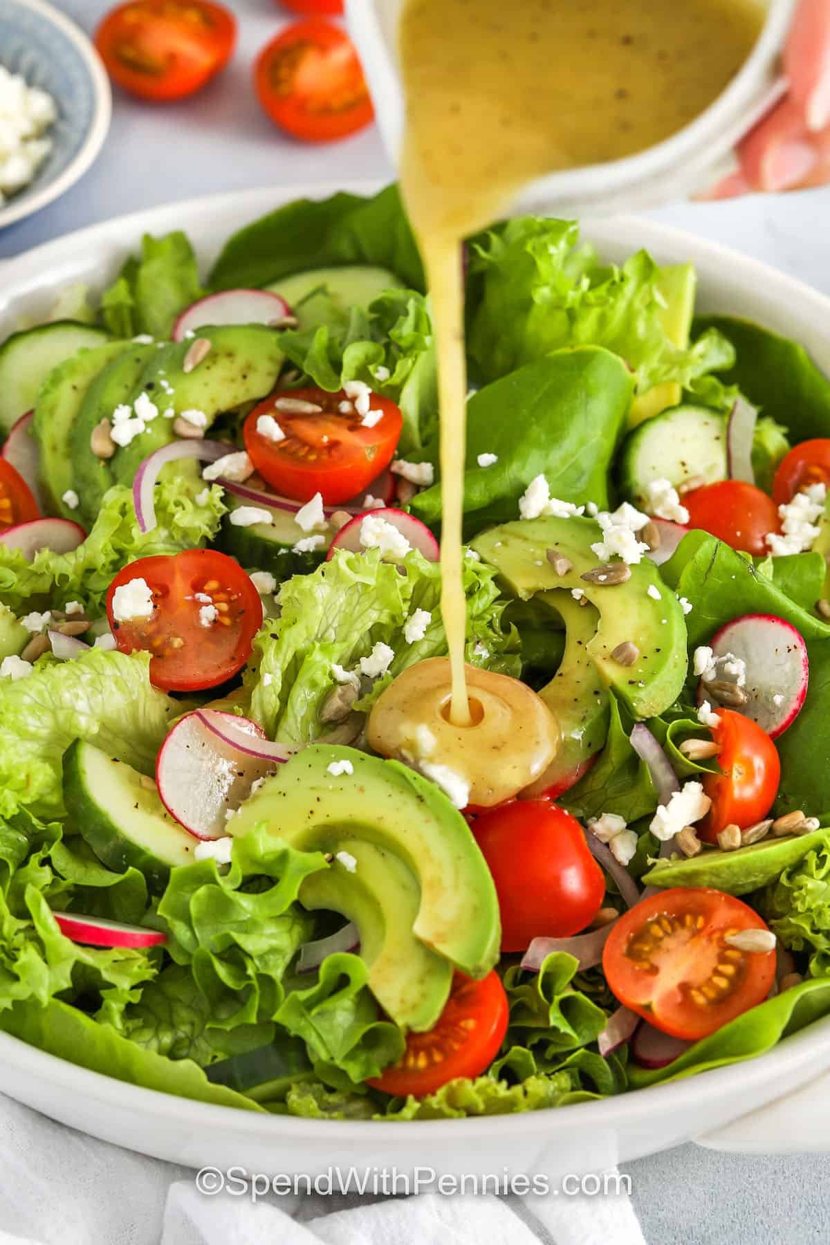 adding dressing to Fresh Summer Salad