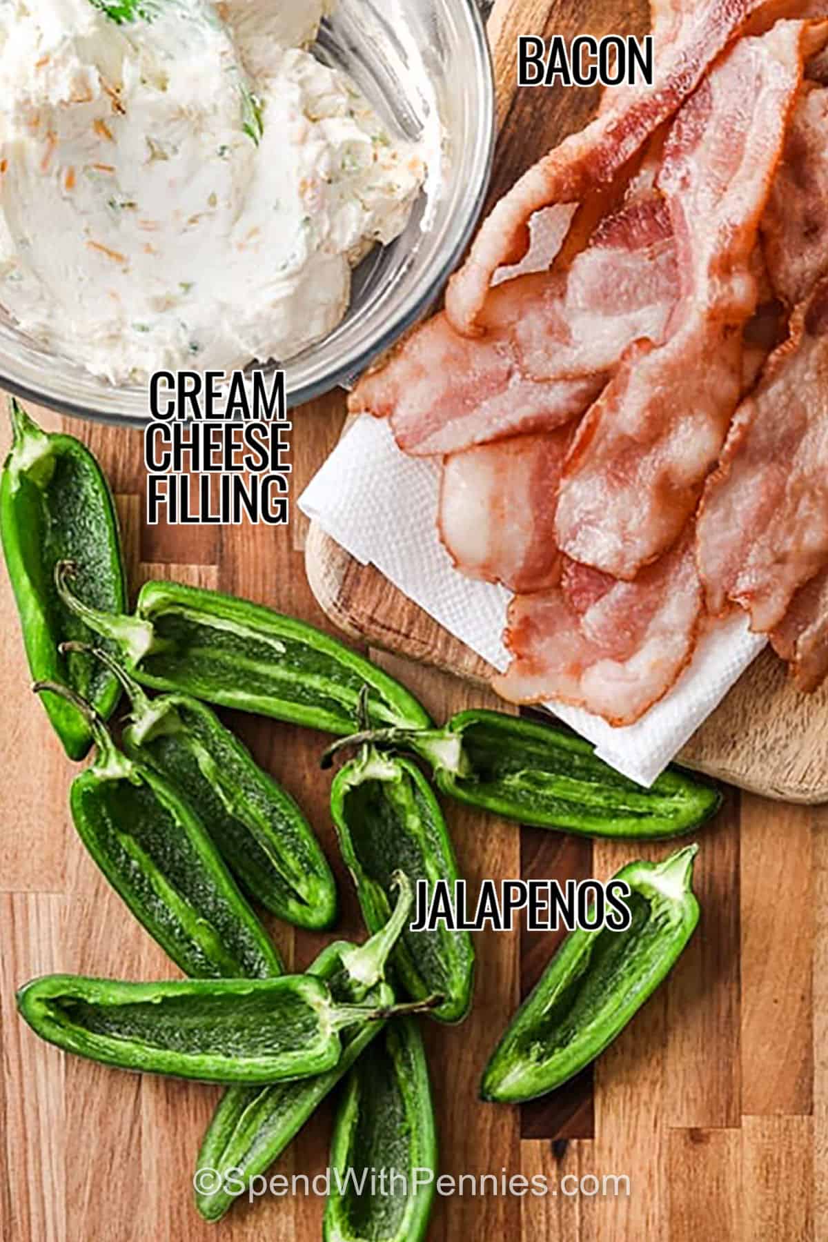 Bacon wrapped jalapeno poppers offer a delicious combo of creamy, cheesy filling with smoky bacon and spicy jalapenos that make a perfect party appetizer. The filling blends cream cheese, sharp cheddar, garlic powder, and green onion for layered taste. Simple to prepare and cook, these poppers are great for impressing guests with minimal effort. #spendwithpennies jalapenos , bacon , cream cheese filling with labels to make Bacon Wrapped Jalapeno Poppers