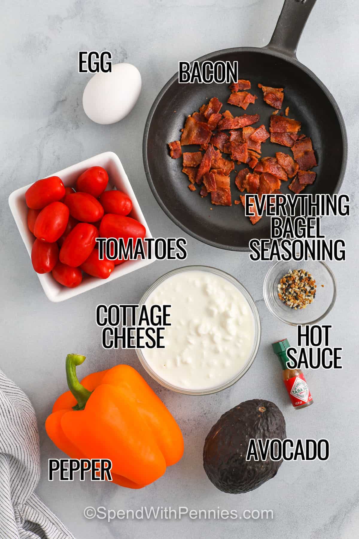 Cottage cheese breakfast bowls are perfect for a quick, easy, and healthy start to the day. These bowls come together in minutes and can be adjusted to fit any taste. Ideal for busy mornings or meal prep. A satisfying, balanced breakfast option that’s both nutritious and delicious! #spendwithpennies egg , bacon , tomatoes , cottage cheese , pepper , avocado , hot sauce , everything bagel seasoning with labels to make Cottage Cheese Breakfast Bowls