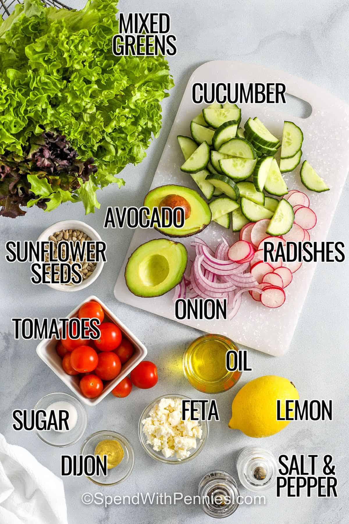 mixed greens , cucumber , avocado , radishes , onion , sunflower seeds , tomatoes , oil , feta , lemon , dijon , sugar , salt and pepper with labels to make Fresh Summer Salad