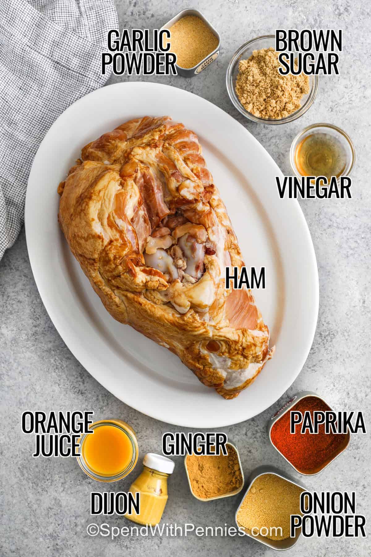 onion powder , brown sugar , vinegar , paprika , garlic powder , ginger , dijon , orange juice , ham with labels to make Pulled Ham