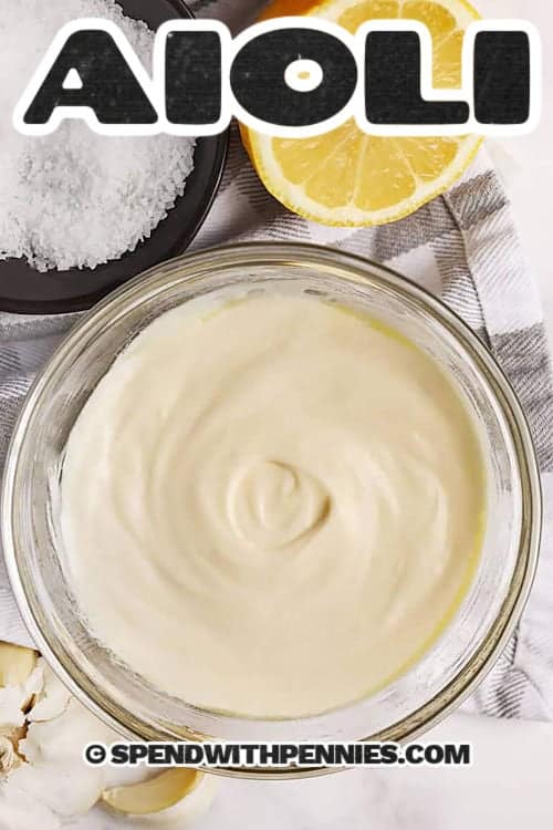 bowl of Aioli with lemon , garlic and salt around it with a title