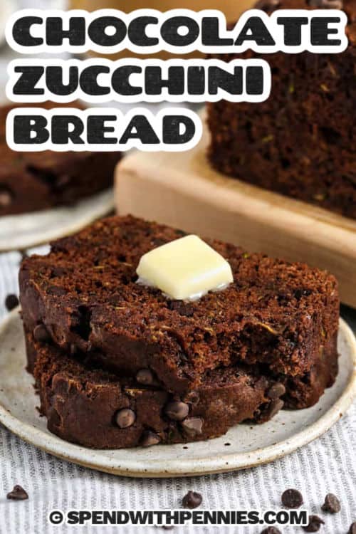 This chocolate zucchini bread recipe is the best way to use up fresh zucchini. It’s moist, rich, and packed with double chocolate flavor thanks to cocoa and mini chocolate chips. Applesauce keeps things light, so it’s a healthy treat you can feel good about. Want even more crunch? Add in some chopped almonds or walnuts for extra texture. This simple homemade loaf is one you’ll make again and again. #spendwithpennies plated Chocolate Zucchini Bread slices with butter and a title