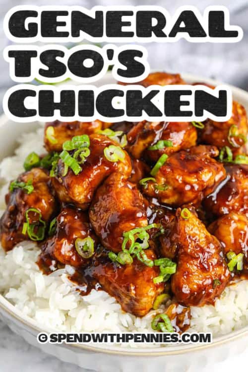 This recipe for General Tso’s chicken brings a Chinese restaurant favorite to your own kitchen. Tender chunks of chicken are batter coated and fried crispy. A super flavorful sauce featuring garlic, ginger, onion, red pepper flakes, brown sugar, toasted sesame oil, soy and hoisin sauces forms the foundation of this mouthwatering dish Serve this tasty dish over rice, noodles, or even shredded and cooked cabbage to cut a few calories. #spendwithpennies bowl of General Tso's Chicken with rice and green onions with a title