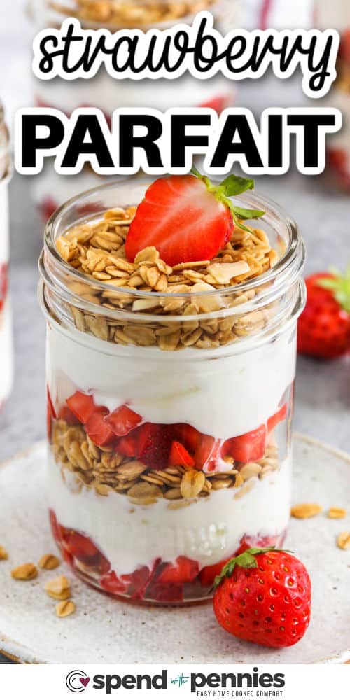 A strawberry parfait is the perfect mix of creamy yogurt, sweet berries, and crunchy granola. It’s a quick recipe that’s light on calories but big on flavor. You can switch it up with blueberries, jello, or even chocolate for a tasty dessert. Try adding whipped cream or cheesecake filling to make it feel like shortcake in a cup! #spendwithpennies creamy Strawberry Parfait in jars with a title