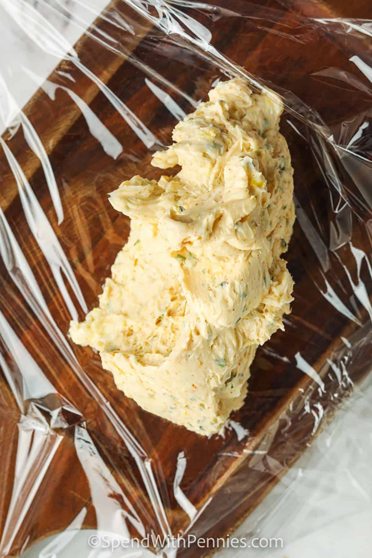 adding Steak Butter to saran wrap
