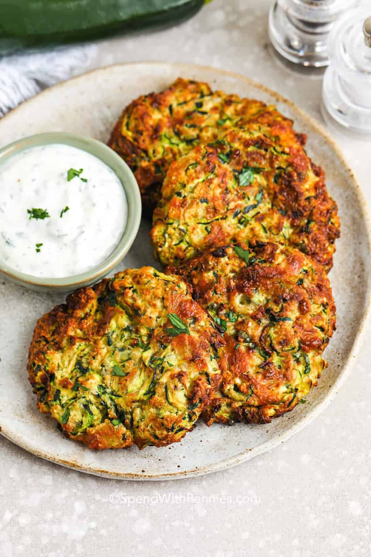 plate of Zucchini Fritters with dip
