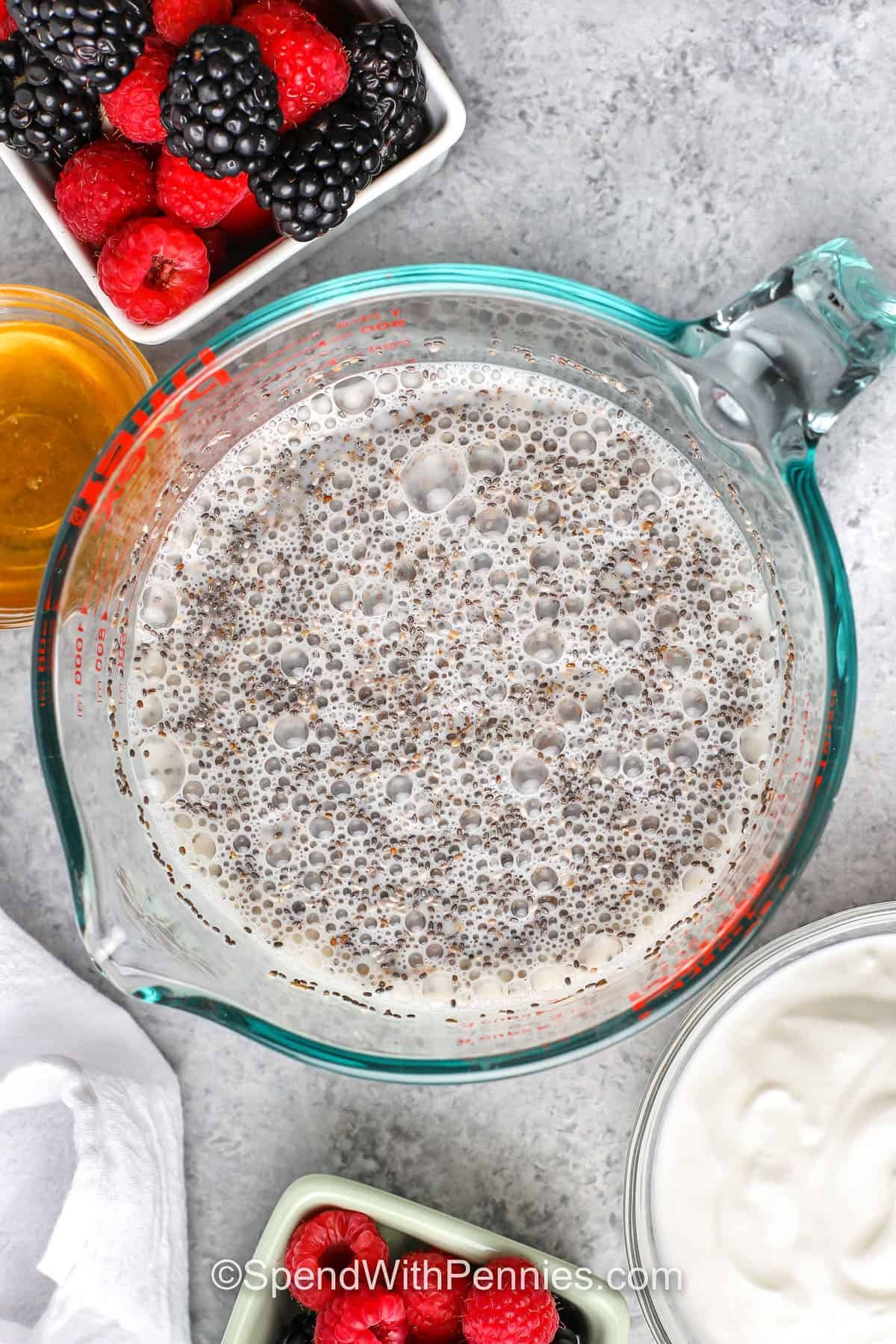 measuring cup with ingredients to make Chia Seed Pudding