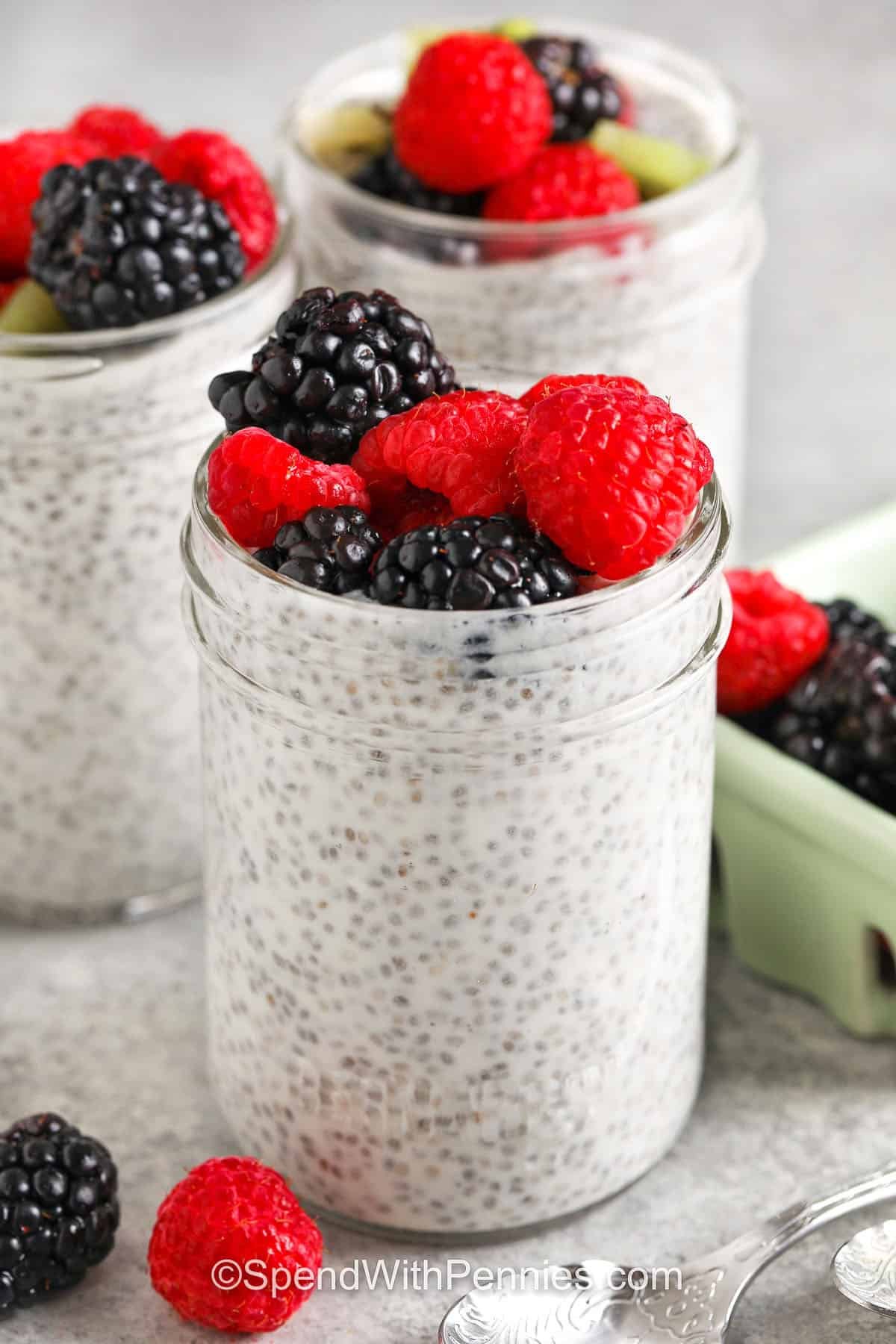 jars of Chia Seed Pudding with berries on top
