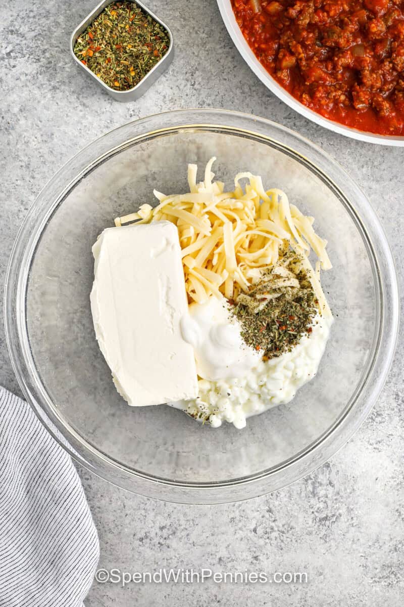 addin cottage cheese , sour cream, cream cheese , mozzarella and italian seasoning to bowl together to make Million Dollar Spaghetti