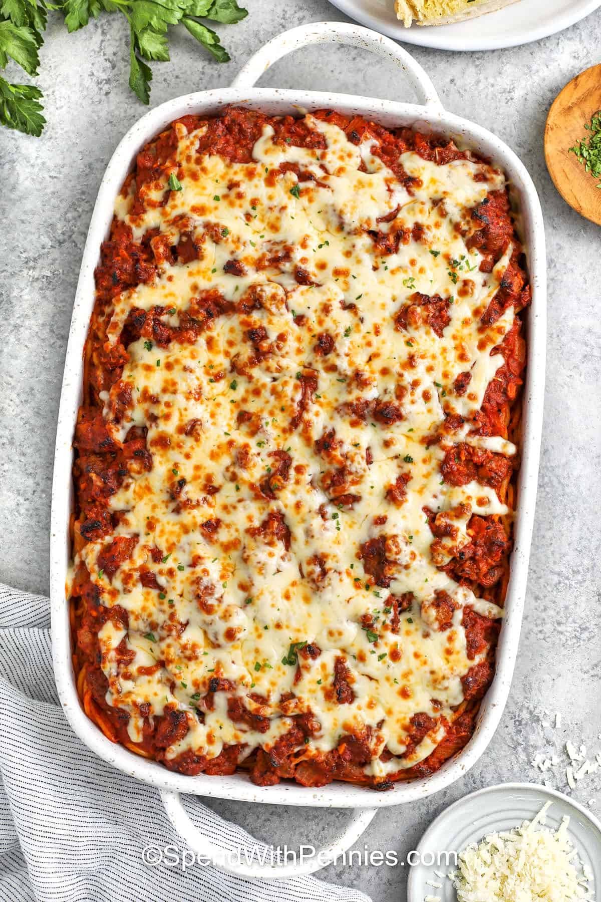 cheesy Million Dollar Spaghetti baked in a casserole dish