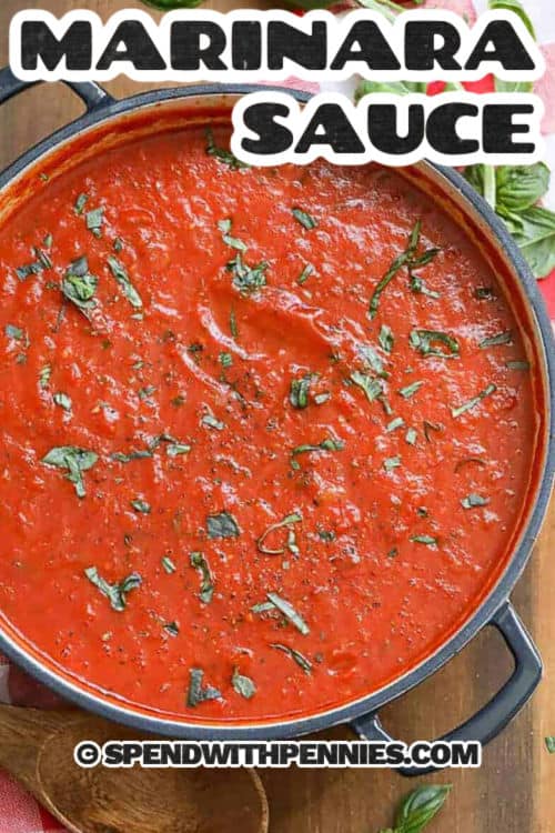 Easy marinara sauce is rich, flavorful, and made with simple pantry ingredients like onions, carrots, garlic, and tomatoes. Slowly simmered with olive oil, oregano, and fresh basil, it develops a perfect balance of sweetness and tang. This versatile sauce pairs beautifully with pasta, pizza, or as a dipping sauce for breadsticks, making it a must-have recipe in any kitchen. #spendwithpennies Easy Marinara Sauce in a pot with basil and a title