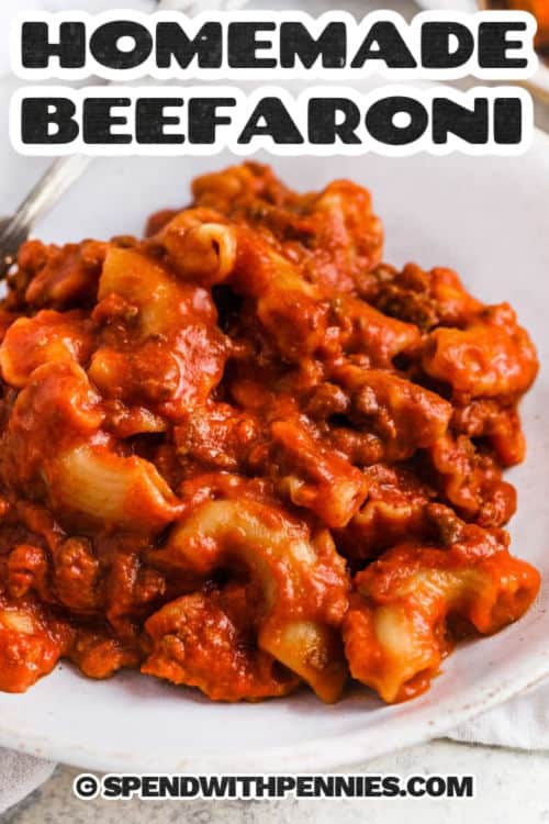 Beefaroni is a classic pasta dish that’s full of cheesy, savory flavor in every bite. This homemade version is made from scratch with ground beef, crushed tomatoes, and a touch of cream cheese for cheesy richness. Cooked all in one pot on the stovetop, it’s a simple, satisfying dinner the whole family will love. Serve it with bread or a fresh salad for the ultimate comfort meal. #spendwithpennies close up of creamy Homemade Beefaroni with a title