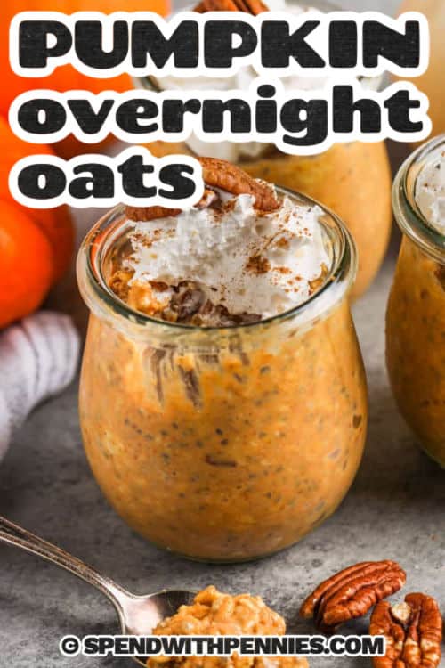 Delicious pumpkin overnight oats are loaded with warm spices and healthy ingredients to keep you energized all morning long. In this easy no-cook recipe, rolled oats are mixed with pumpkin puree, chia seeds, sweetener, and yogurt. Fill some jars and refrigerate overnight for an easy grab-and-go breakfast. Try it with pumpkin pie spices, pecan, and maple syrup for a comforting and wholesome snack or morning meal. Swirl in some almond or peanut butter for variety. #spendwithpennies jar of Pumpkin Overnight Oats with whipped cream and pecans with a title