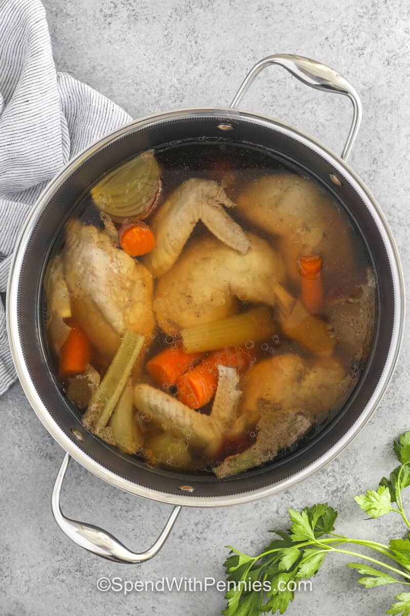 ingredients cooking in pot to make Old Fashioned Chicken and Dumplings