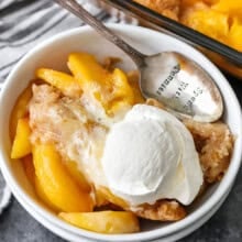 Peach Cobbler in a bowl with a spoon