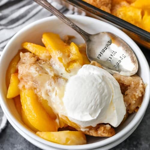 Peach Cobbler in a bowl with a spoon