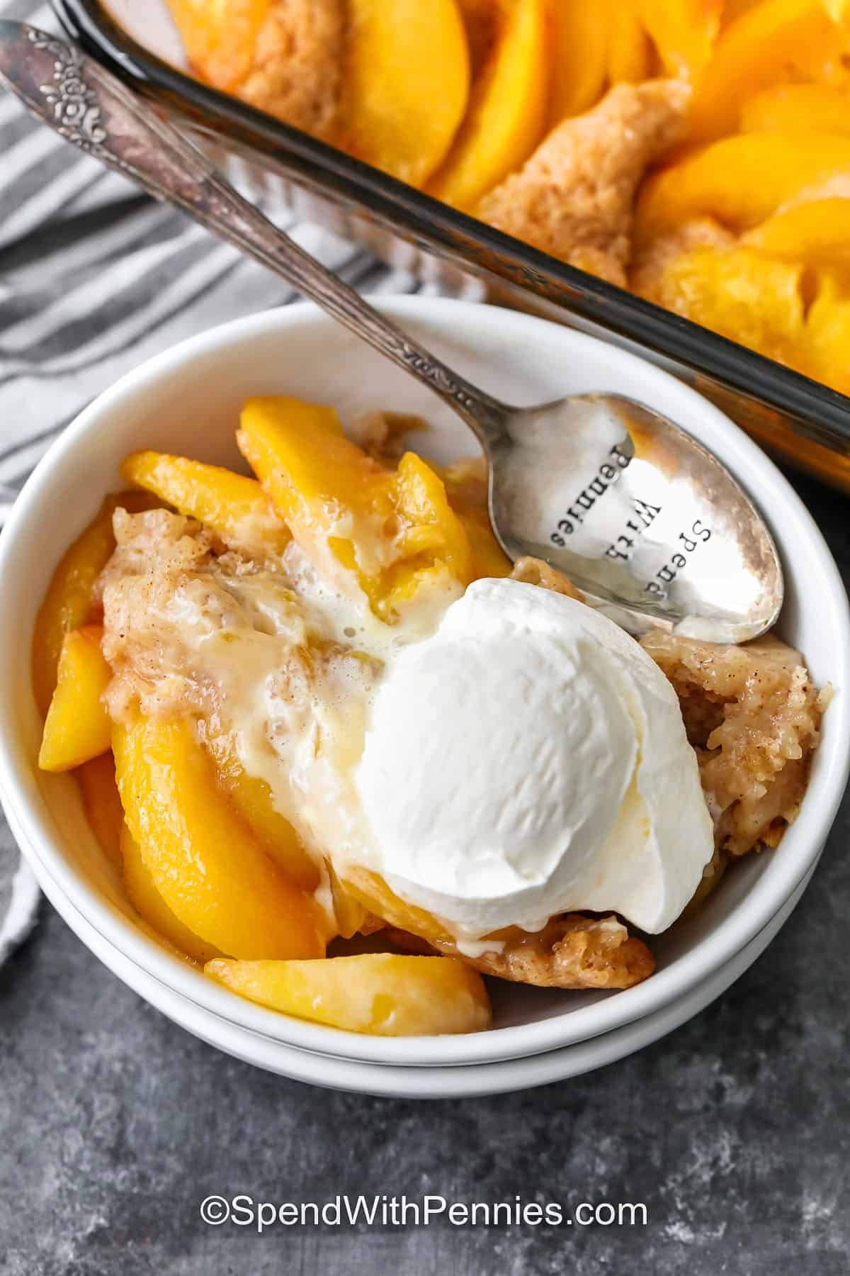 Peach Cobbler in a bowl with a spoon