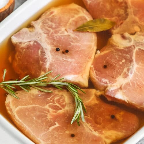 close up of pork chop marinading to make Pork Chop Brine