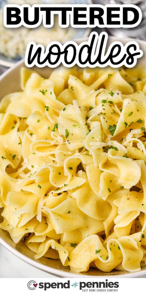 Buttered noodles are a warm and comforting pasta dish that’s as easy to make as it is delicious. Egg noodles are tossed with melted butter, garlic powder, and fresh parsley, then topped with a sprinkle of Parmesan for an extra touch. This homemade stovetop recipe is quick to season and makes one of the best side dishes for busy weeknights or cozy, simple dinners. #spendwithpennies cheesy Buttered Noodles with a title