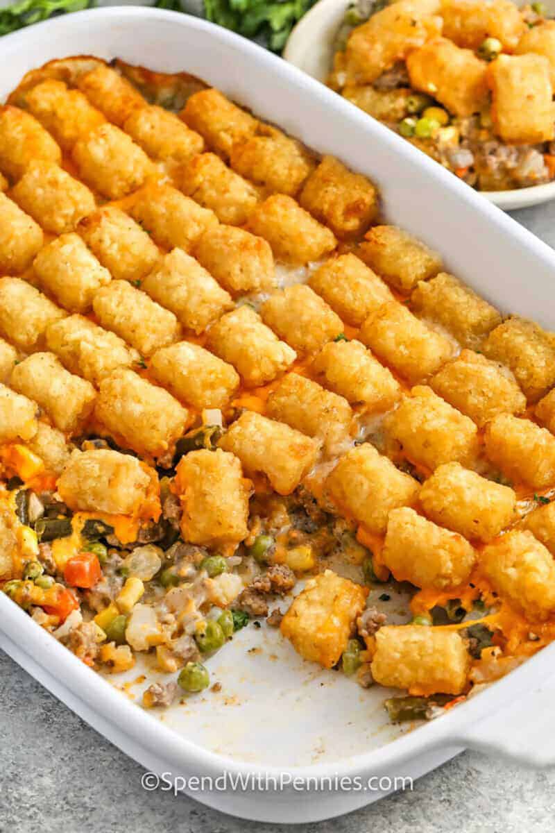 Classic Tater Tot Casserole in the casserole dish with a portion missing