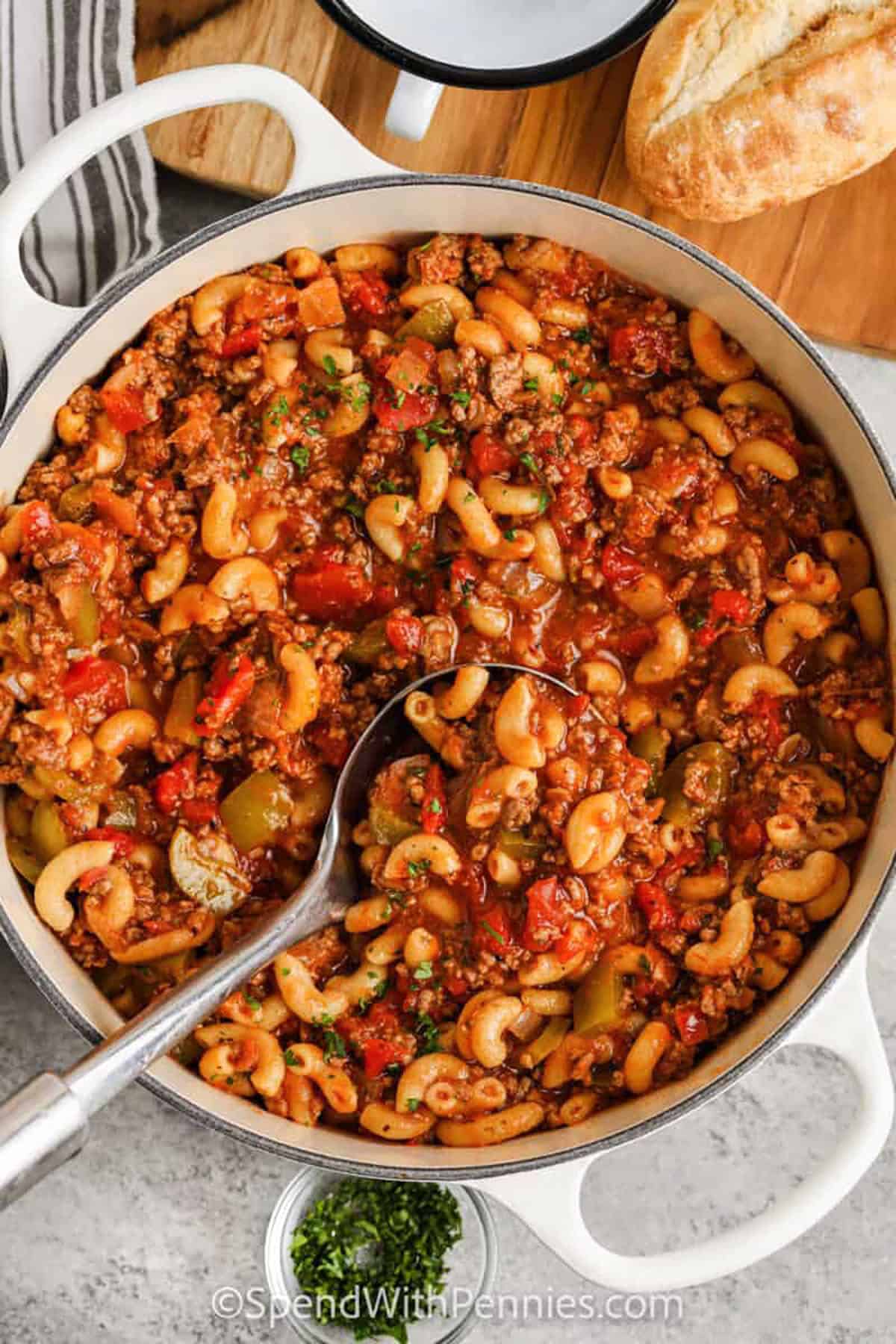 Craving comfort food? This goulash recipe brings all the cozy vibes with savory beef, onions, garlic, diced tomatoes, and tender pasta in a flavorful marinara-based broth. The touch of Italian seasoning and optional bell pepper adds depth, while melty cheese takes it over the top. It’s quick, satisfying, and great for leftovers, just heat and eat! Perfect for meal prep or a family dinner. #spendwithpennies pot of Grandma's Goulash