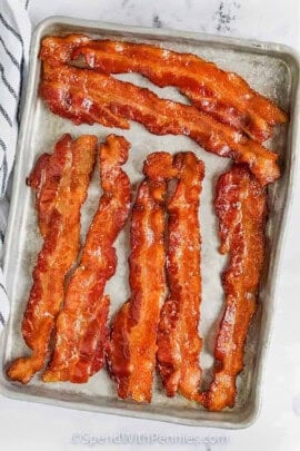 crispy bacon on sheet pan to show How to Cook Bacon in the Oven