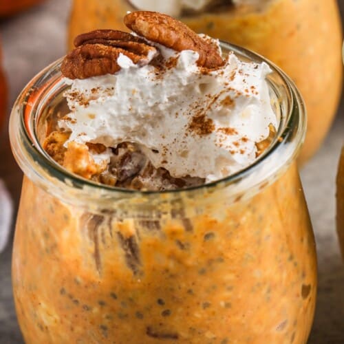 Overnight Pumpkin Oats prepared in a jar and topped with a pecan
