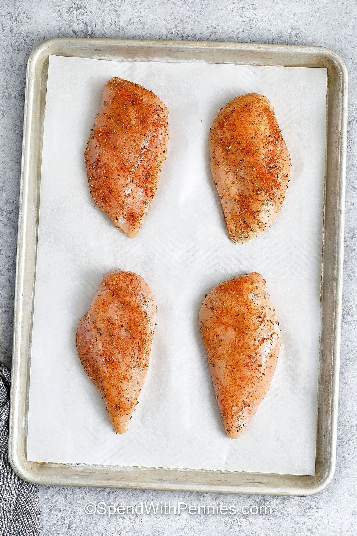Hot honey chicken is a recipe that’s sure to become a favorite for its sweet and spicy flavor. Chicken breasts are baked until tender and coated with a buttery glaze made with hot honey, garlic, and a splash of vinegar. Serve it whole for dinner, slice into strips for a wing-style option, or layer it into a sandwich. It also makes a tasty topping for a fresh salad or a hearty grain bowl. #spendwithpennies seasoned chicken to make Hot Honey Chicken