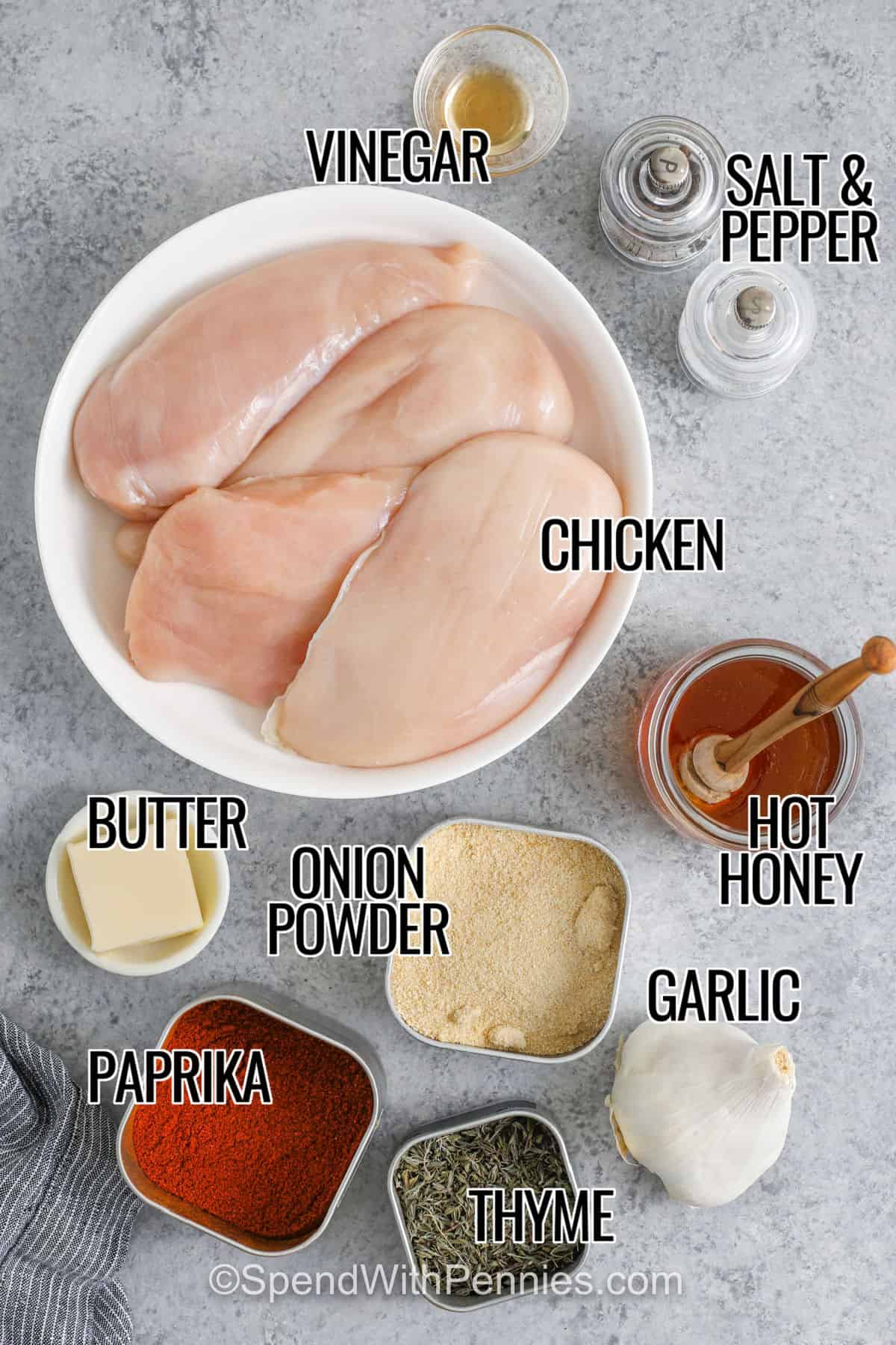 Hot honey chicken is a dish that brings sweet, spicy, and savory flavors all together. Juicy chicken breasts are baked with simple seasoning and then brushed with a buttery hot honey glaze that has a touch of garlic and vinegar. Serve it as whole pieces, cut into strips, or tucked into a sandwich for something extra tasty. Pair it with roasted vegetables, a crisp salad, or even a grain bowl for a complete meal. #spendwithpennies chicken , vinegar , butter , onion powder , paprika , thyme , garlic , hot honey, salt and pepper with labels to make Hot Honey Chicken