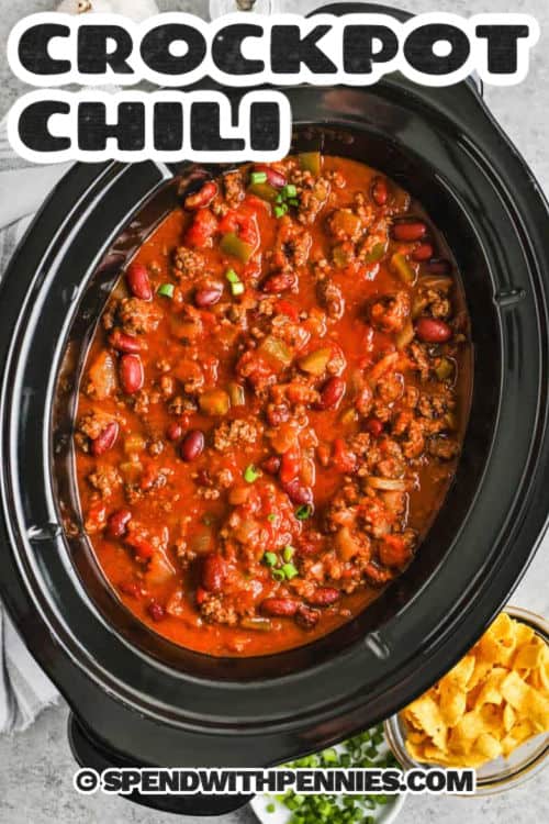 Easy crockpot chili is the ultimate comfort food with rich, hearty flavors and minimal effort. Made with seasoned ground beef, kidney beans, tomatoes, and bold spices, this recipe simmers low and slow in the slow cooker for the perfect texture and depth. Light beer enhances the flavor, and a mix of fresh and canned ingredients adds convenience. Ideal for busy days or meal prep, it's a must-try family favorite. #spendwithpennies pot of Crockpot Chili with a title