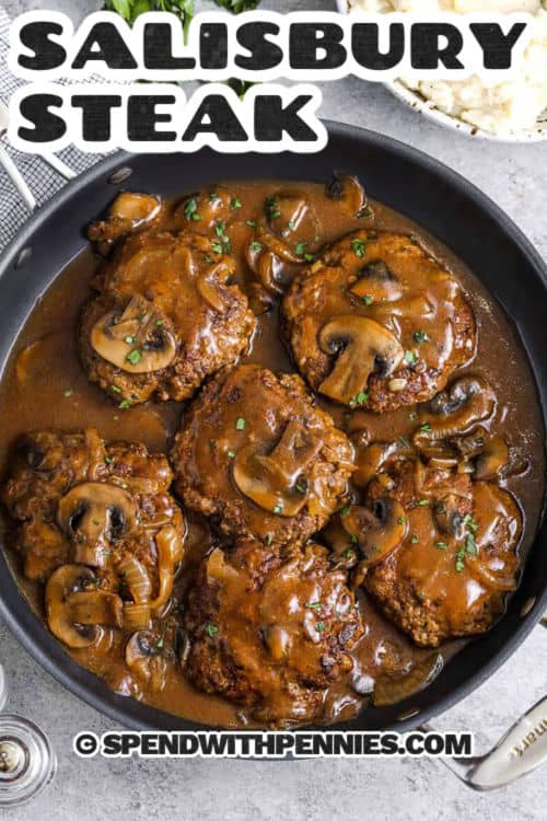 rich and savory Salisbury Steak in a pan with a title