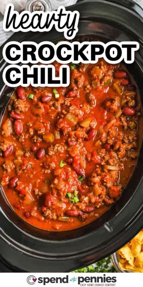Easy crockpot chili is packed with protein and fiber thanks to lean beef and kidney beans, making it both filling and nutritious. A flavorful seasoning blend with smoked paprika, cumin, and oregano adds warmth and depth, while diced onions, garlic, and optional bell peppers bring freshness. Letting it cook all day in the crockpot enhances the flavor, making it even better the next day. #spendwithpennies hearty Crockpot Chili in the pot with a title