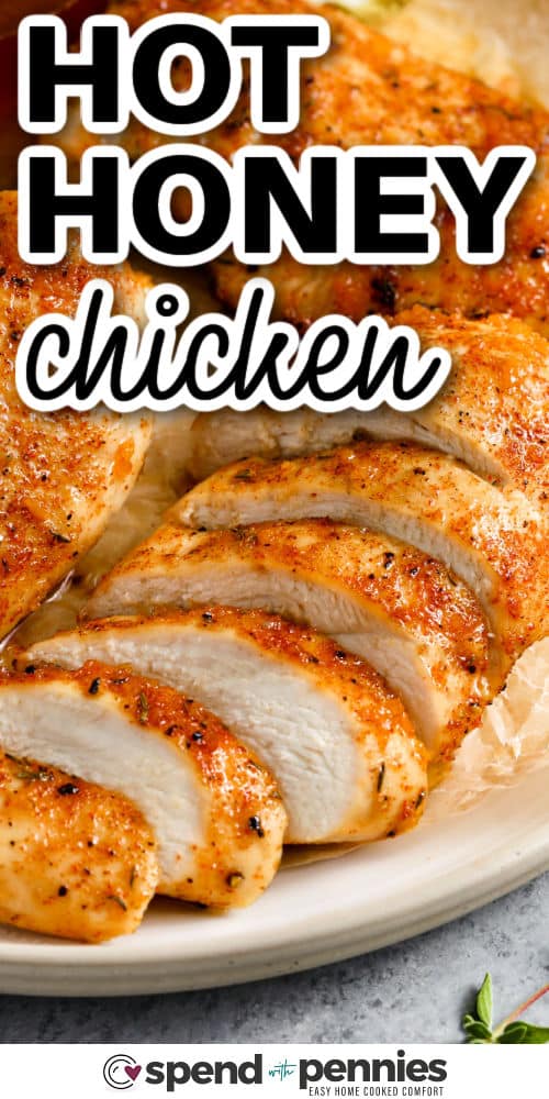 Hot honey chicken is a recipe full of sweet heat and savory flavor. The chicken is baked and finished with a glaze made from hot honey, butter, garlic, and vinegar. The sauce clings to each bite, giving it the perfect balance of spice and tang. Serve this dish alongside vegetables, or slice it up for sandwiches, wings-style bites, or even as a protein for your favorite grain bowl. #spendwithpennies close up of sliced Hot Honey Chicken with a title