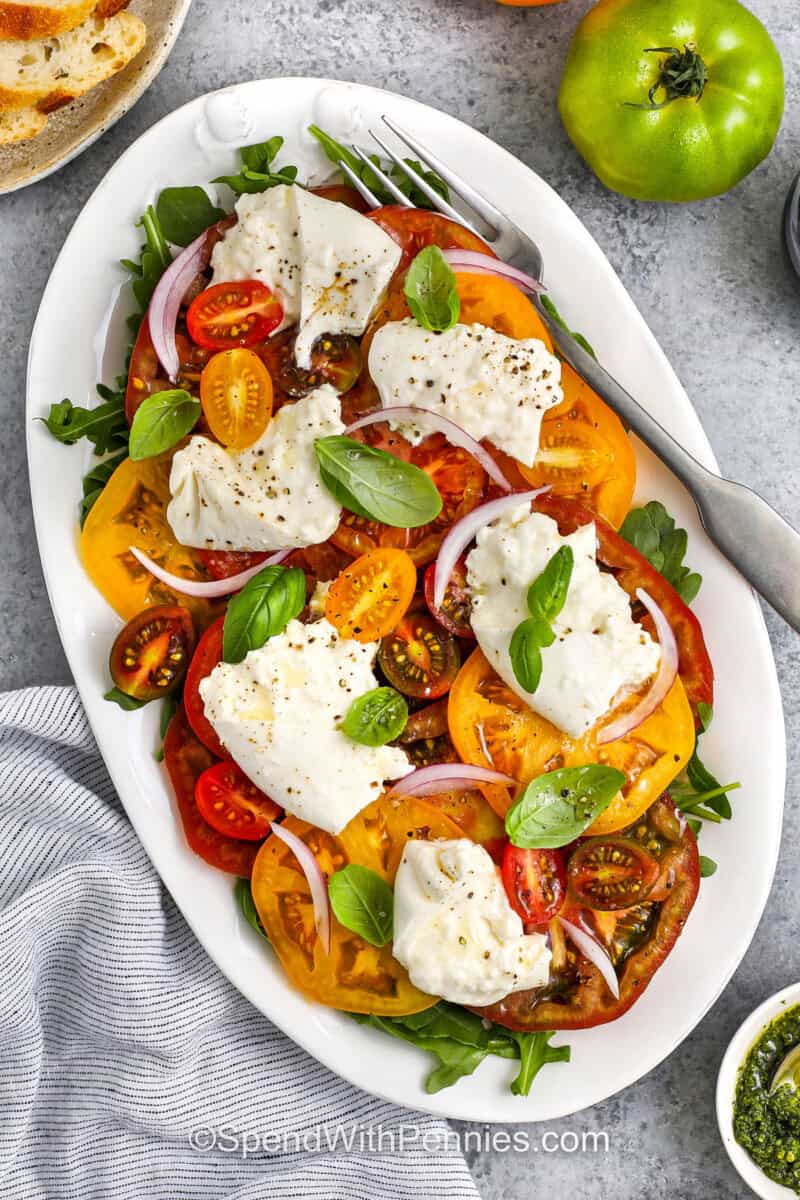 plate of Tomato Burrata Salad with a fork