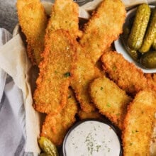 basket of Crispy Fried Pickles with pickles on the side