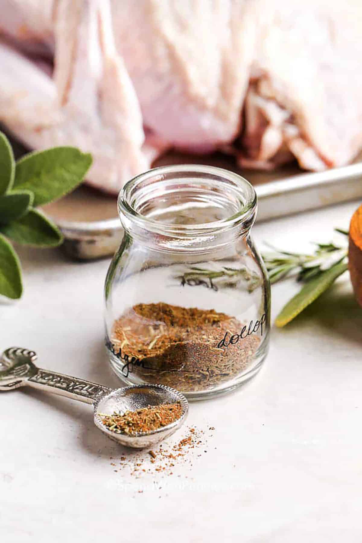 Turkey seasoning is a flavorful blend for roasted or smoked poultry. Combining sage, thyme, paprika, nutmeg, black pepper, and rosemary, this mix is perfect for turkey breast, Thanksgiving dinners, or even soups and casseroles. Use it to enhance any poultry dish with a savory homemade taste. This seasoning keeps well and makes every bite of turkey the best kind of comfort food you can serve. #spendwithpennies Turkey Seasoning in jar and measuring spoon