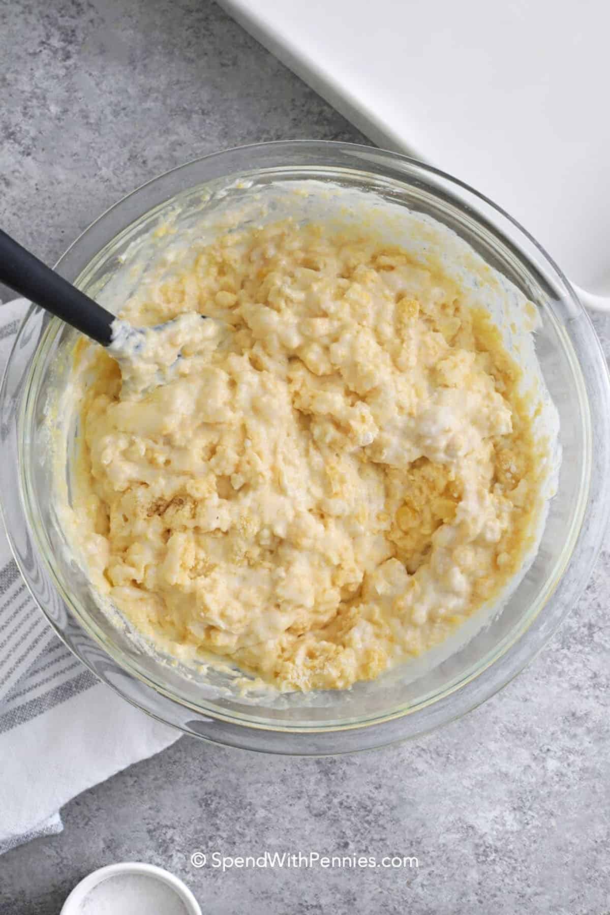 mixing ingredients to make corn casserole