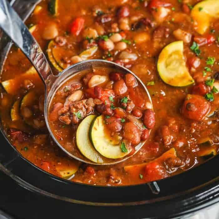 laddle taking a scoop from a Crock Pot Italian Bean Soup
