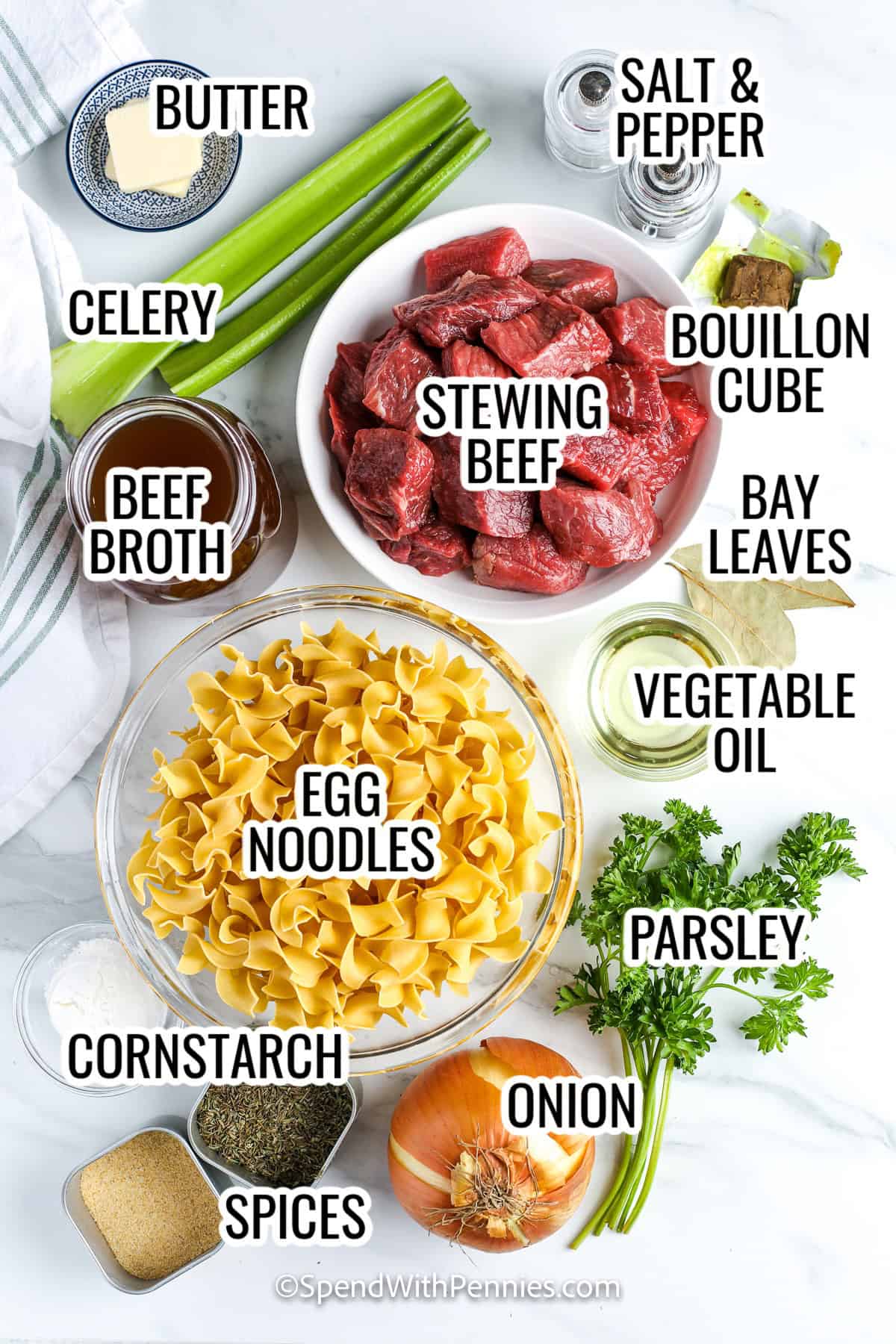 This beef and noodles recipe is a classic dish made with tender beef simmered with onion, celery, and herbs before being served over egg noodles. Finished with a savory gravy, it is hearty and satisfying. This easy meal makes a wonderful dinner for the whole family. Pair it with broccoli, bread, or a side salad for a complete meal. Comfort food does not get much better than this simple and flavorful recipe. #spendwithpennies ingredients assembled to make beef and noodles, including stewing beef, egg noodles, parsley, cornstarch, beef broth, celery, parsley, onioin, and spices