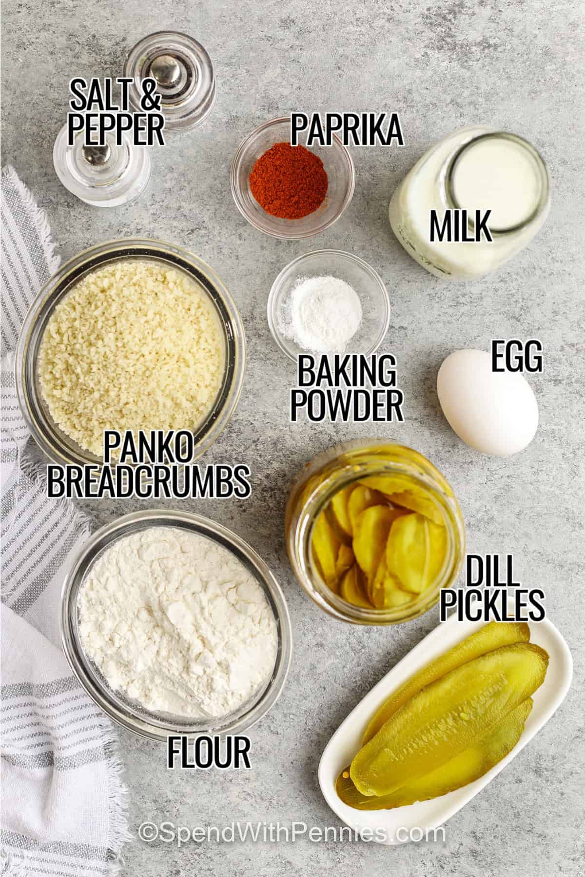 Fried pickles are the ultimate crunchy snack, made with juicy dill pickle slices and a crispy golden coating. This recipe uses a batter and Panko crumb crust to give every bite a delicious crunch. Pair them with ranch dip, spicy sauce, or even serve them with chicken sandwiches or burgers. For more dill flavor, make them into spears or pickle chips for easy dipping. Fried pickles are the best appetizer to share with family and friends. #spendwithpennies  salt & pepper, paprika, milk, egg, baking powder, panko breadcrumbs, flour, and dill pickles