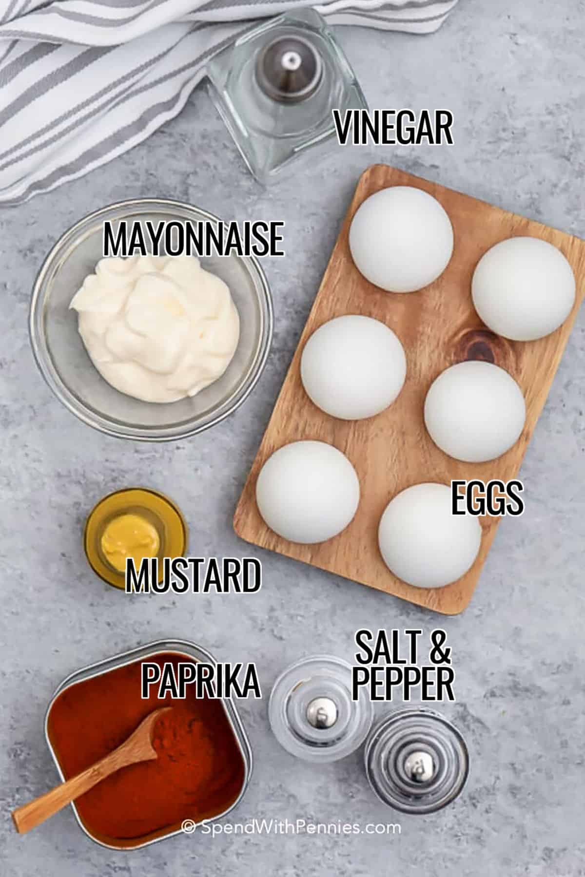 For the perfect deviled eggs recipe, look no further than this delicious dish. The creamy yolk filling is made with mayonnaise, mustard, and vinegar, and topped with paprika or bacon for extra flavor. This appetizer is simple to make, looks beautiful on a tray, and is always a hit at brunches, parties, or holiday meals. It pairs perfectly with fresh vegetables, cheeses, or your favorite charcuterie. #spendwithpennies vinegar , mayonnaise , eggs , mustard , paprika, salt and pepper with labels to make Deviled Eggs
