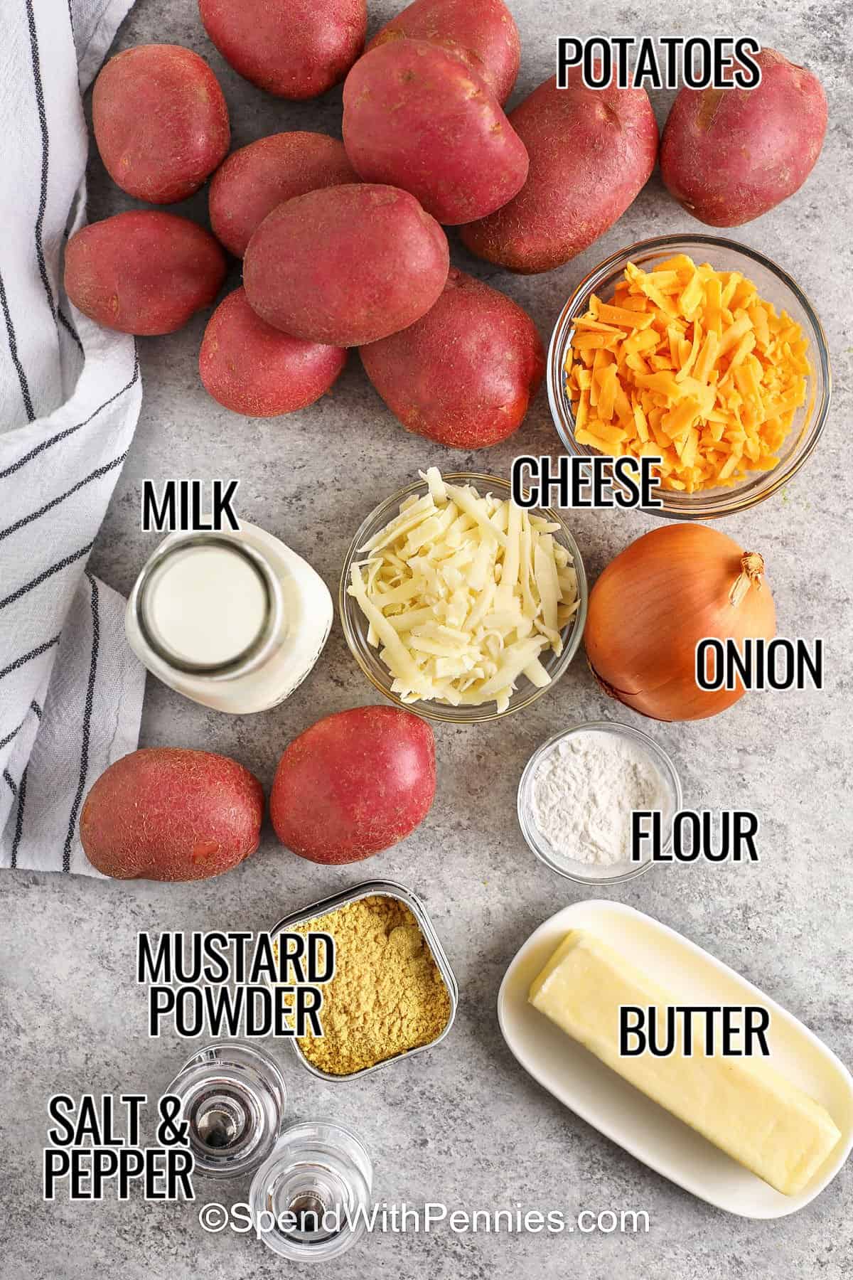 This delicious recipe for potatoes au gratin is rich, creamy, and full of cheesy goodness. Sliced potatoes and onions are baked in a smooth, golden cheese sauce that’s simply irresistible. This classic recipe is easy to cook and perfect for holidays or Sunday dinners. #spendwithpennies potatoes , cheese , milk , onion , flour , butter, mustard powder , salt and pepper with labels to make Potatoes Au Gratin