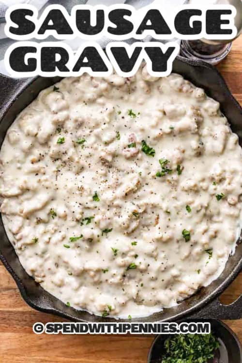 This sausage gravy recipe is a classic family favorite that is so creamy and delicious. It starts with a meaty and tender breakfast sausage that is pan fried. Some butter is melted in the same pan, along with some flour, and milk is slowly whisked into the sauce. The result is a velvety sauce that packs a punch of flavor. Serve it over morning biscuits, potatoes, or as a base for a casserole. #spendwithpennies Sausage Gravy Recipe in a pan with a title
