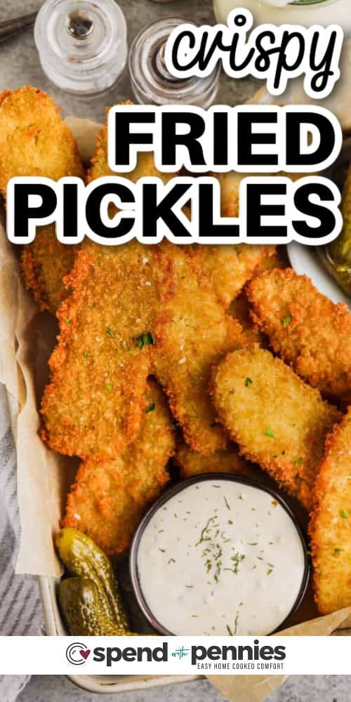Fried pickles are a tasty treat with the perfect mix of crunchy coating and tangy dill flavor. This recipe dips pickle slices into a batter, then rolls them in Panko crumbs before frying them until golden brown. They’re delicious with ranch dip or any sauce you love. Try them as pickle spears for a bold bite or chip-style for easy dipping. They pair perfectly with chicken sandwiches or as a fun appetizer that everyone will want to make. #spendwithpennies Crispy Fried Pickles with dip and a title