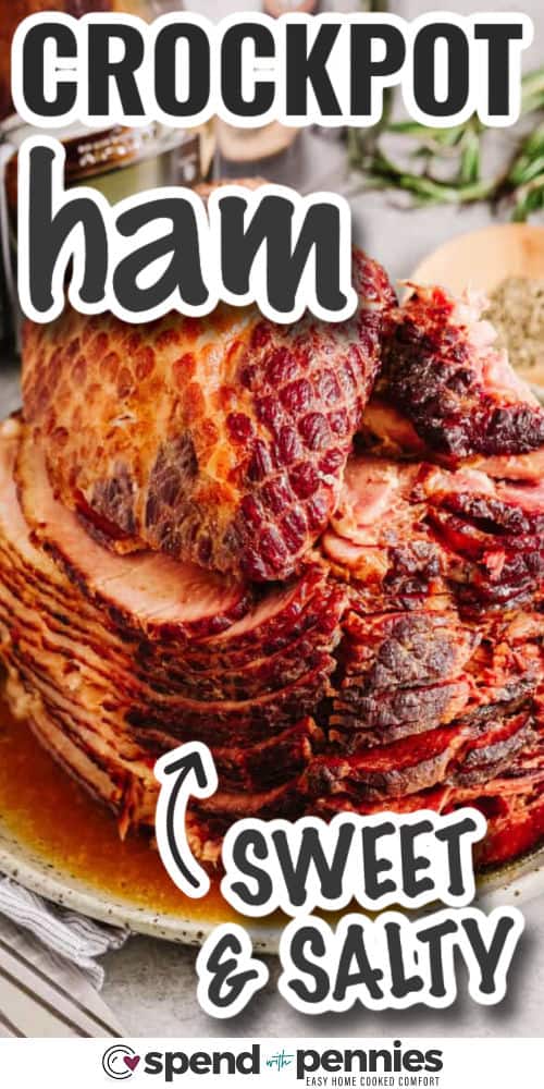 Crockpot ham turns an already flavorful spiral ham into a delicious meal. This recipe blends brown sugar, apple preserves, and Dijon mustard for a sweet-savory coating. Cook it low in the slow cooker to lock in juices while rosemary adds a subtle aroma. Serve with baked potatoes, baked beans, or even a creamy soup for a comforting plate. Leftovers are ideal for sandwiches or breakfast dishes that taste like a treat. #spendwithpennies cooked and sliced crockpot ham with writing