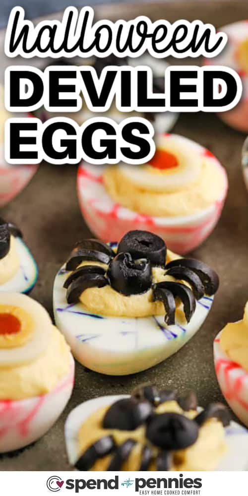 Halloween deviled eggs are a recipe that brings creepy-cute food to your party table. With marbled egg whites, scary eyeballs, or spider shapes on top, these are just right for costume night. They’re simple to make and even more fun to decorate with your own ideas, like pumpkin faces or avocado toppings. They’re a festive way to add spooky eye-catching flair to your Halloween celebration. #spendwithpennies Halloween Deviled Eggs with edible spiders on top and a title